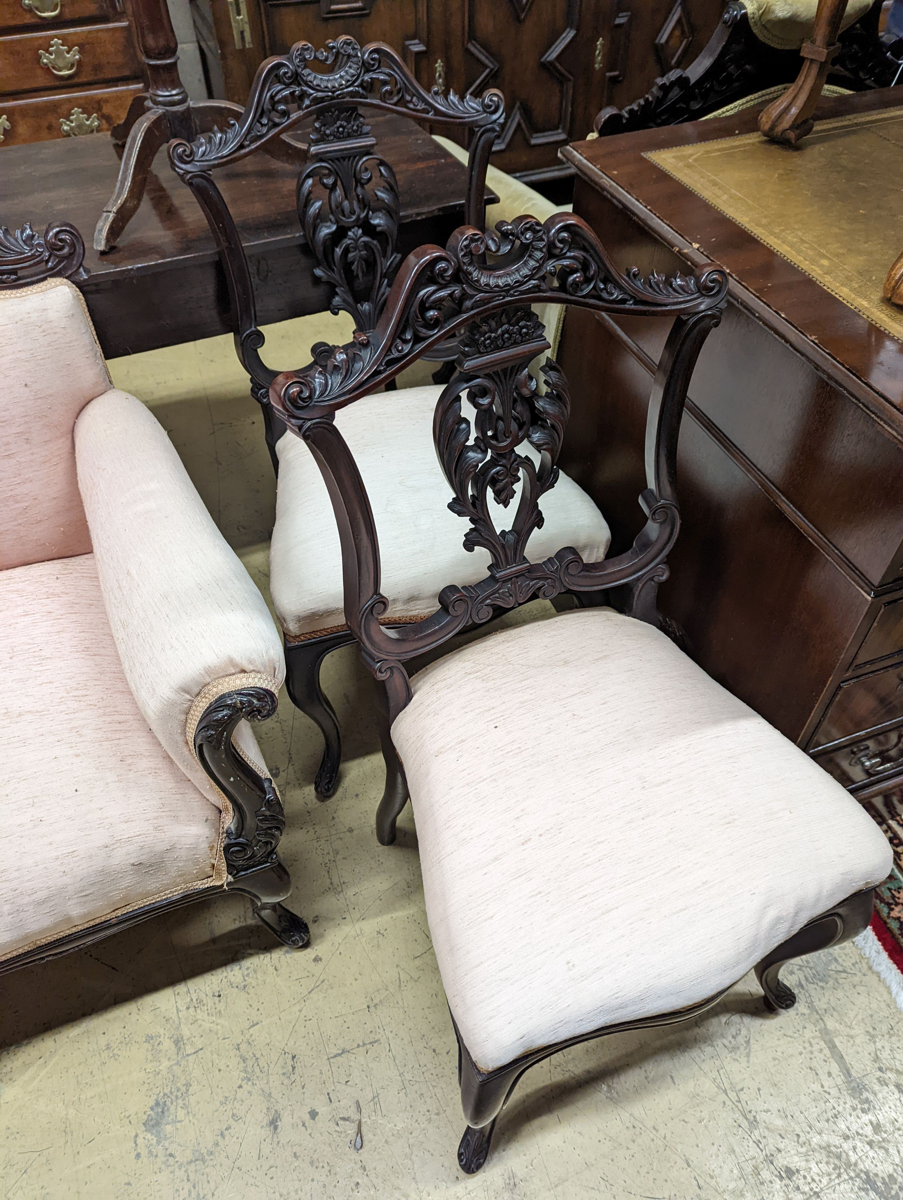 A late Victorian carved mahogany seven piece salon suite, settee length 140cm, depth 60cm, height 94cm